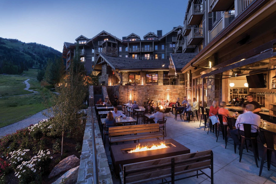 Suggested venue with outdoor fire pit dining at dusk